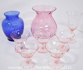 Set of Pink Glassware Including Champagne Coupes Vases. 