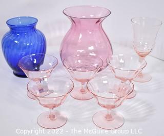 Set of Pink Glassware Including Champagne Coupes Vases. 