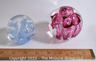 Two (2) Hand Blow Glass Paperweights Signed Joe St. Claire and Quality Trading. 