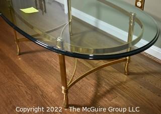 Contemporary Oval Brass and Glass Coffee Table.  46ʺW × 26ʺD × 16ʺH
