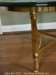 Contemporary Oval Brass and Glass Coffee Table.  46ʺW × 26ʺD × 16ʺH
