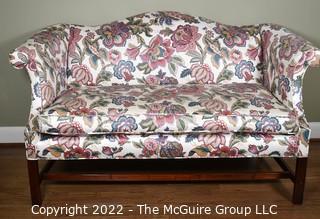 20th Century Chintz Upholstered Settee Loveseat.  One of a pair.  56" long.