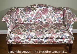 20th Century Chintz Upholstered Settee Loveseat.  One of a pair.  56" long.