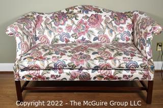 20th Century Chintz Upholstered Settee Loveseat.  One of a pair.  56" long.