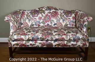 20th Century Chintz Upholstered Settee Loveseat.  One of a pair.  56" long.