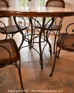 Drexel Heritage Inlaid Marble-Top Table with Wrought Iron Base and Four Cane Chairs. Table 40" in diameter.