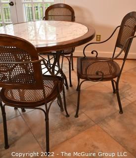 Drexel Heritage Inlaid Marble-Top Table with Wrought Iron Base and Four Cane Chairs. Table 40" in diameter.