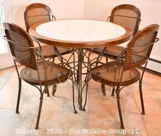 Drexel Heritage Inlaid Marble-Top Table with Wrought Iron Base and Four Cane Chairs. Table 40" in diameter.