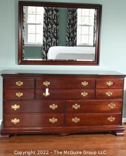 Pennsylvania House Classics Chippendale Style Cherry Chest of Drawers with Mirror.  Features six upper drawers and four larger lower drawers and brass pulls.  Dresser measures 66.0" W x 34.5" H x 19.0" D.  Mirror Measures 48" W x 36" H .