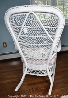 White Painted Wicker Rocking Chair with Cushion and Throw Pillow.