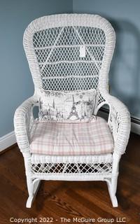 White Painted Wicker Rocking Chair with Cushion and Throw Pillow.