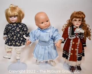 Three (3) Dolls Two (2) Porcelain and One Pleasant Company Baby Doll.