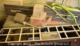 Scaffolding, work light, sawhorses, router table, tablesaw blades and truck hitch.  There are additional cross beams for scaffolding in Lot 120A  