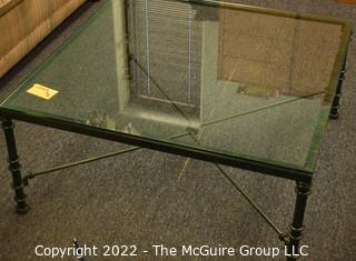 Metal frame coffee table with glass insert.  Measures 36 x 36 x 12"T