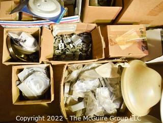 Multiple boxes containing lighting fixtures, parts and accessories.  Encourage inspection. 