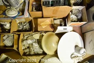 Multiple boxes containing lighting fixtures, parts and accessories.  Encourage inspection. 