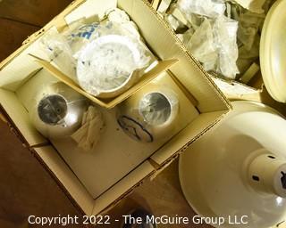 Multiple boxes containing lighting fixtures, parts and accessories.  Encourage inspection. 