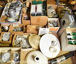 Multiple boxes containing lighting fixtures, parts and accessories.  Encourage inspection. 