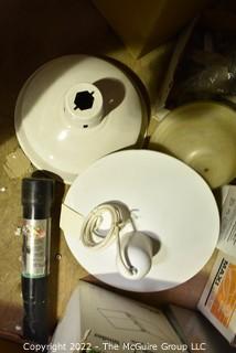 Multiple boxes containing lighting fixtures, parts and accessories.  Encourage inspection. 