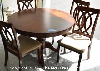 Round Mahogany Pedestal Table with Four (4) Sheraton Style Dining Chairs. 