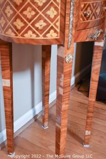 Louis XVI Style Marquetry Side Table with Tulip Wood Inlay, Metal Decoration, Gilt Embossed Florentine Leather Lined Pull out Tray and Drawer.   One of pair being offered. Some veneer loss, pieces included.  14" x 21" x 31"T