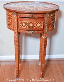 Louis XVI Style Marquetry Side Table with Tulip Wood Inlay, Metal Decoration, Gilt Embossed Florentine Leather Lined Pull out Tray and Drawer.   One of pair being offered. Some veneer loss, pieces included.  14" x 21" x 31"T