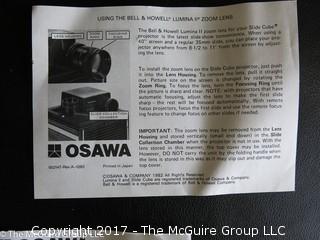 New Bell and Howell slide projector (Model AF70) and 6 Argus slide trays 