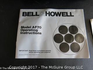 New Bell and Howell slide projector (Model AF70) and 6 Argus slide trays 