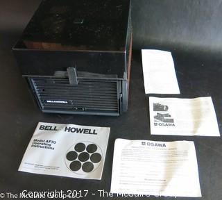 New Bell and Howell slide projector (Model AF70) and 6 Argus slide trays 