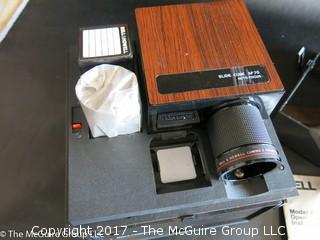 New Bell and Howell slide projector (Model AF70) and 6 Argus slide trays 