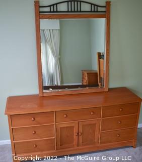 Thomasville Impressions Oak 7 Chest of Drawers with Matching Wall Mirror.  Dresser measures 30" x 18" x  71"L.  Mirror measures 40" x 51".