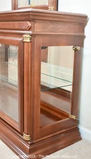 Display case with attached mirror