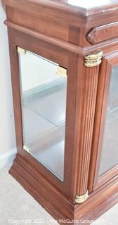 Display case with attached mirror