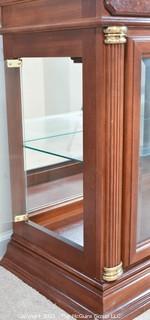 Display case with attached mirror