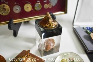 Eclectic grouping including glass paperweights and military medal in presentation box 