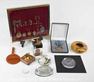 Eclectic grouping including glass paperweights and military medal in presentation box 