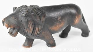 Antique Carved Walnut Figure of a Striding Lion.  Measures 7" long.