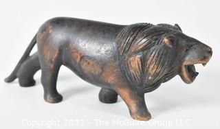 Antique Carved Walnut Figure of a Striding Lion.  Measures 7" long.