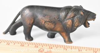 Antique Carved Walnut Figure of a Striding Lion.  Measures 7" long.