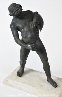 Vintage Bronze "Satyr with a Wineskin" Sculpture After the Sculpture From the House of the Centenary, Pompeii. The statuette, mounted on a base in travertine marble, measures 10" tall, 7" wide and 4" deep.