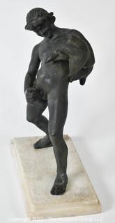 Vintage Bronze "Satyr with a Wineskin" Sculpture After the Sculpture From the House of the Centenary, Pompeii. The statuette, mounted on a base in travertine marble, measures 10" tall, 7" wide and 4" deep.