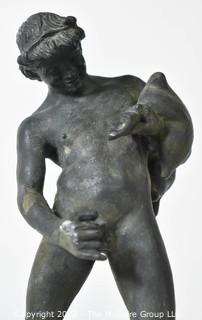 Vintage Bronze "Satyr with a Wineskin" Sculpture After the Sculpture From the House of the Centenary, Pompeii. The statuette, mounted on a base in travertine marble, measures 10" tall, 7" wide and 4" deep.