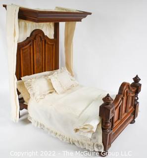 SALESMAN SAMPLE. Miniature (18"L x 19" Tall) Antique Inlaid Mahogany Half Tester Canopy Bed with Bed Linens and Draperies, Made by Edward Stott (1838 - 1881) Cabinet Maker and Upholsterer, 110 Yorkshire Street, Rochdale, Manchester UK. Measures 11" x 18" x 19". (NOTE: This Lot is part of a set (24RH, 25RH, 30RH, 30RHA, 31RH, 32RH).  Lot 60 RHA consists of the ENTIRE SET OF 6 LOTS.  If the high bid for Lot 60RHA exceeds the sum of High bids for (24RH, 25RH, 30RH, 30RHA, 31RH, 32RH), they will be sold as a set.  If you have questions about the process, text David at 202-441-5446