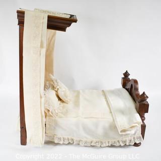 SALESMAN SAMPLE. Miniature (18"L x 19" Tall) Antique Inlaid Mahogany Half Tester Canopy Bed with Bed Linens and Draperies, Made by Edward Stott (1838 - 1881) Cabinet Maker and Upholsterer, 110 Yorkshire Street, Rochdale, Manchester UK. Measures 11" x 18" x 19". (NOTE: This Lot is part of a set (24RH, 25RH, 30RH, 30RHA, 31RH, 32RH).  Lot 60 RHA consists of the ENTIRE SET OF 6 LOTS.  If the high bid for Lot 60RHA exceeds the sum of High bids for (24RH, 25RH, 30RH, 30RHA, 31RH, 32RH), they will be sold as a set.  If you have questions about the process, text David at 202-441-5446