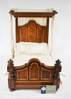 SALESMAN SAMPLE. Miniature (18"L x 19" Tall) Antique Inlaid Mahogany Half Tester Canopy Bed with Bed Linens and Draperies, Made by Edward Stott (1838 - 1881) Cabinet Maker and Upholsterer, 110 Yorkshire Street, Rochdale, Manchester UK. Measures 11" x 18" x 19". (NOTE: This Lot is part of a set (24RH, 25RH, 30RH, 30RHA, 31RH, 32RH).  Lot 60 RHA consists of the ENTIRE SET OF 6 LOTS.  If the high bid for Lot 60RHA exceeds the sum of High bids for (24RH, 25RH, 30RH, 30RHA, 31RH, 32RH), they will be sold as a set.  If you have questions about the process, text David at 202-441-5446