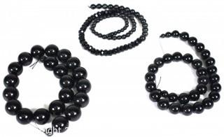 Three (3) Strands of Polished Onyx Beads.