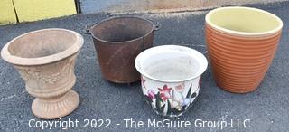 Four (4) Garden Planters Made of Ceramic, Cement, Porcelain and Cast Iron Pot (with cracks)