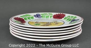 Collection of Hand-Painted Porcelain Plates in Various Designs.