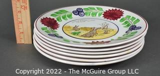 Collection of Hand-Painted Porcelain Plates in Various Designs.