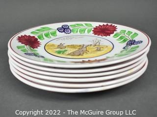 Collection of Hand-Painted Porcelain Plates in Various Designs.